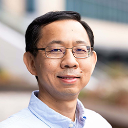 Headshot of Gang Chen, Ph.D. wearing a white shirt